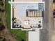 Aerial view of an elegant rooftop deck with outdoor kitchen, jacuzzi, and dining and lounging areas at 10340 2Nd N Way, St Petersburg, FL 33716