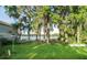Scenic backyard with mature trees and Spanish moss, providing privacy and charm at 10818 Land O Lakes Blvd, Land O Lakes, FL 34638