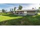 Spacious backyard with a patio and lush lawn, perfect for outdoor living and entertaining at 10818 Land O Lakes Blvd, Land O Lakes, FL 34638