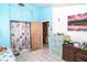 Bright, cozy bedroom with tiled flooring, beach-themed decor, and natural light at 10818 Land O Lakes Blvd, Land O Lakes, FL 34638