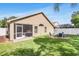 Spacious backyard with a screened patio and fire pit, perfect for outdoor living and entertaining at 11324 Cypress Reserve Dr, Tampa, FL 33626