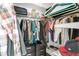 Spacious walk-in closet with ample hanging storage and shelving for optimal organization at 11324 Cypress Reserve Dr, Tampa, FL 33626