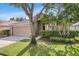 Charming single-story home with a well-manicured lawn and mature trees at 11324 Cypress Reserve Dr, Tampa, FL 33626