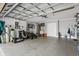 Spacious two-car garage featuring epoxy flooring, ample storage space, and well-organized utility area at 11324 Cypress Reserve Dr, Tampa, FL 33626