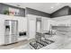 Modern kitchen with stainless steel appliances, granite countertops, and gas range at 11324 Cypress Reserve Dr, Tampa, FL 33626