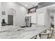 Kitchen with stainless steel appliances, white cabinetry, and island seating at 11324 Cypress Reserve Dr, Tampa, FL 33626