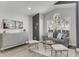 Modern living room featuring hardwood floors, a comfortable grey sofa, and stylish decor at 11324 Cypress Reserve Dr, Tampa, FL 33626