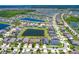 Scenic aerial view of a neighborhood with beautiful ponds and lush landscaping, perfect for families at 11612 Sunburst Marble Rd, Riverview, FL 33579