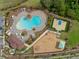 Aerial shot of community amenities, including a pool, basketball court, playground, and clubhouse at 11612 Sunburst Marble Rd, Riverview, FL 33579