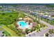 Aerial image showcasing the community pool, playground, and surrounding neighborhood at 11612 Sunburst Marble Rd, Riverview, FL 33579