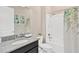 Bathroom featuring a granite vanity, white tile, and shower-tub combination with a green shower curtain at 11612 Sunburst Marble Rd, Riverview, FL 33579