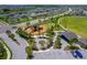 Gathering-friendly park featuring a playground and picnic shelter, surrounded by well-manicured landscaping at 11612 Sunburst Marble Rd, Riverview, FL 33579