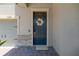 Elegant front door with a decorative wreath and stone accents at 11612 Sunburst Marble Rd, Riverview, FL 33579