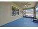 Relaxing screened lanai with ceiling fan, hammock, and a view of the backyard, ideal for outdoor living at 11612 Sunburst Marble Rd, Riverview, FL 33579