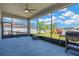 Spacious screened lanai with hammock, grill, and views of the lush backyard, perfect for entertaining at 11612 Sunburst Marble Rd, Riverview, FL 33579