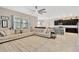 Open-concept living room connected to the kitchen, featuring a large sectional sofa at 11612 Sunburst Marble Rd, Riverview, FL 33579