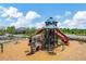 Community playground with climbing structures, slides, and shaded areas for children to enjoy at 11612 Sunburst Marble Rd, Riverview, FL 33579