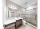 Bright bathroom featuring vanity, toilet, and glass shower at 11623 Tetrafin Dr, Riverview, FL 33579