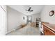 Bedroom with neutral carpet, ceiling fan, closet, and a window at 11623 Tetrafin Dr, Riverview, FL 33579