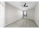 Bright carpeted bedroom with ceiling fan and window creates a cozy personal space at 11623 Tetrafin Dr, Riverview, FL 33579