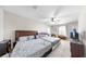 Spacious bedroom with neutral carpet, ceiling fan, and natural light from the window at 11623 Tetrafin Dr, Riverview, FL 33579