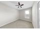 Standard bedroom with neutral walls, carpet flooring, ceiling fan, and a window at 11623 Tetrafin Dr, Riverview, FL 33579