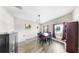 Dining room features a table set for four, a modern light fixture, and neutral walls at 11623 Tetrafin Dr, Riverview, FL 33579