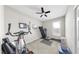 Carpeted workout room with fan, natural light, and workout equipment at 11623 Tetrafin Dr, Riverview, FL 33579
