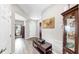 Spacious foyer with light gray walls, wood floors, and a glimpse into other living spaces at 11623 Tetrafin Dr, Riverview, FL 33579
