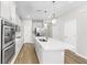 Spacious kitchen with island, stainless appliances, and seamless transition to the living area at 11623 Tetrafin Dr, Riverview, FL 33579