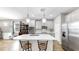 Contemporary kitchen featuring stainless steel appliances, ample counter space, and a center island with seating at 11623 Tetrafin Dr, Riverview, FL 33579