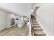 View of kitchen with stainless appliances, island with sink, and open to the staircase at 11623 Tetrafin Dr, Riverview, FL 33579