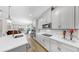 Bright open kitchen with white cabinets, quartz countertops and stainless appliances at 11623 Tetrafin Dr, Riverview, FL 33579