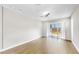 Bright and airy living room with light hardwood floors and sliding glass doors at 11623 Tetrafin Dr, Riverview, FL 33579
