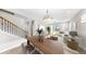 Staged living and dining room with wood floors and neutral decor at 11623 Tetrafin Dr, Riverview, FL 33579