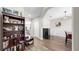 Neutral room with hardwood floors leads into the dining room, kitchen, and front of the house at 11623 Tetrafin Dr, Riverview, FL 33579