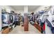 Organized walk-in closet with shelves, hanging racks, and ample storage space at 11623 Tetrafin Dr, Riverview, FL 33579