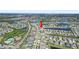 Expansive aerial view of a residential neighborhood with multiple homes, community lakes, and lush green landscaping at 11726 Sunburst Marble Rd, Riverview, FL 33579