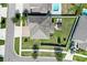Aerial view of a home with a well-maintained backyard and a patio set, perfect for outdoor gatherings at 11726 Sunburst Marble Rd, Riverview, FL 33579