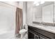 Bathroom with granite vanity, tub with tile surround and neutral walls at 11726 Sunburst Marble Rd, Riverview, FL 33579