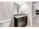 Half bath featuring granite vanity top, undermount sink, and neutral walls at 11726 Sunburst Marble Rd, Riverview, FL 33579