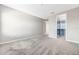 Spacious bedroom with plush carpeting, a walk-in closet, and neutral walls at 11726 Sunburst Marble Rd, Riverview, FL 33579