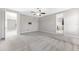 Bedroom with a ceiling fan, connections for a wall mounted television, and grey carpet at 11726 Sunburst Marble Rd, Riverview, FL 33579