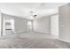 Spacious bedroom with neutral tones, carpet, ceiling fan, and natural light at 11726 Sunburst Marble Rd, Riverview, FL 33579
