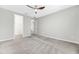The bedroom is neutrally decorated with plush carpet and features a closet for extra storage at 11726 Sunburst Marble Rd, Riverview, FL 33579
