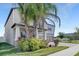 Charming two-story home boasting lush landscaping, well-manicured lawn, and a paver driveway at 11726 Sunburst Marble Rd, Riverview, FL 33579