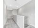 Upstairs hallway with plush carpet and neutral paint at 11726 Sunburst Marble Rd, Riverview, FL 33579