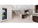 Open floor plan with a kitchen island, stainless steel appliances and plenty of living space at 11726 Sunburst Marble Rd, Riverview, FL 33579