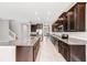 Beautiful open kitchen with stainless steel appliances, granite counters, and large island at 11726 Sunburst Marble Rd, Riverview, FL 33579