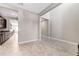 Bright living area showcasing tile floors, neutral walls, and seamless flow into other spaces at 11726 Sunburst Marble Rd, Riverview, FL 33579